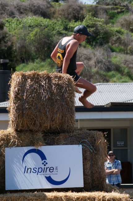 Over the hay bale mountain - three tiers high. Note bare feet - these guys and girls are made of tough stuff. 